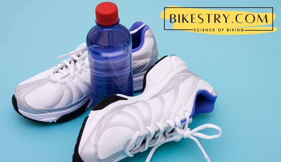 No brand running shoes and a bottle of plain water